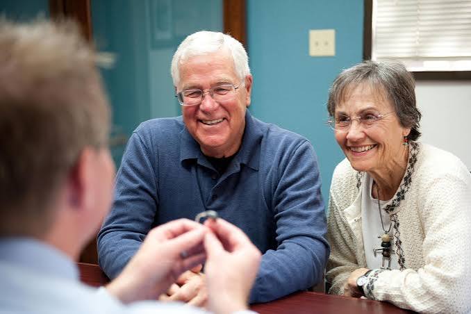 Happy seniors at consultation