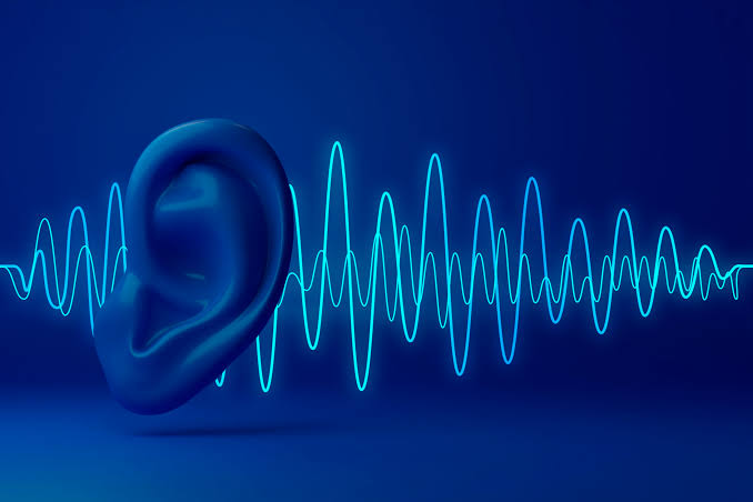 Audiologist conducting hearing test